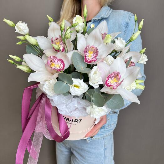 Orchid with an eustoma in a box
