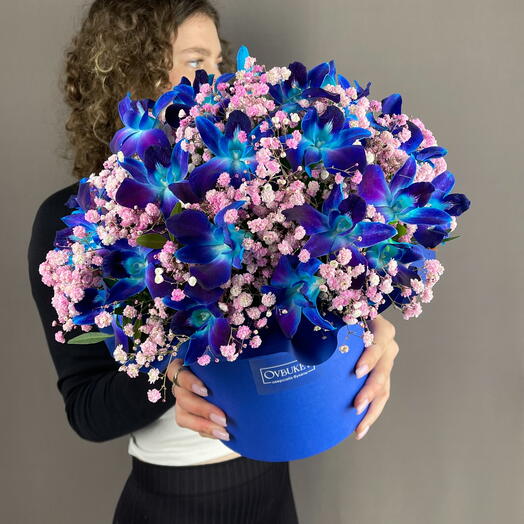 Flowers in a box with an orchid and a pink Gypsophila