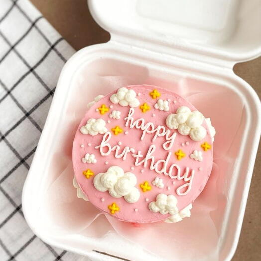 Pink butter cream with White clouds Birthday cake