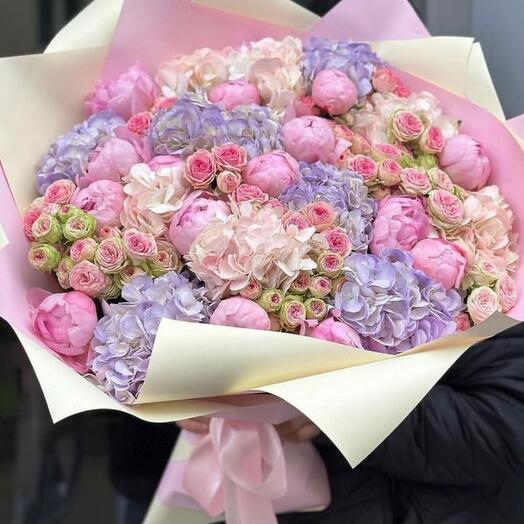 Bouquet of pink peonies, bush peony-shaped roses, assorted hydrangeas