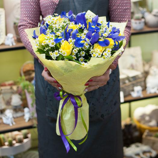 Bouquet of yellow roses, blue irises and daisies