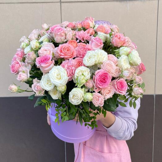 Flowers in a box with delicate bush roses