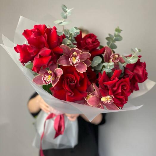Bouquet of red roses and pink orchids