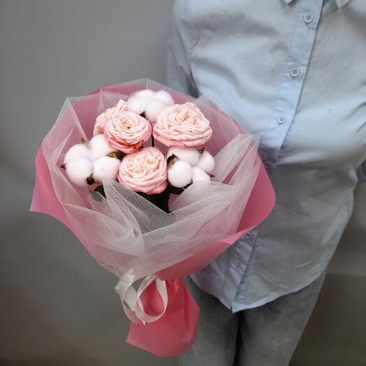 Delicate bouquet of bushy peony-shaped roses and cotton