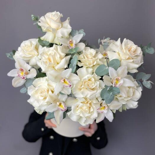 White roses with white orchids and eucalyptus in a box
