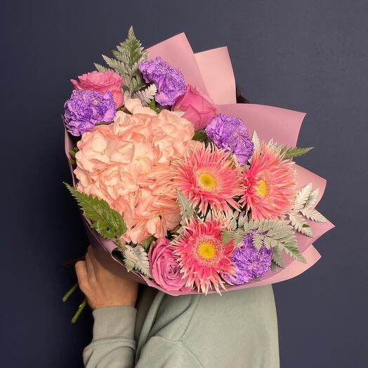 Delicate bouquet with hydrangeas and gerberas and varietal dianthus in pink tones