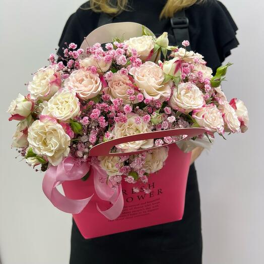 Composition Openwork lace made of bush pink rose and gypsophila
