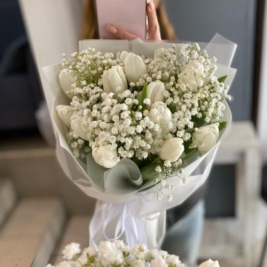 A delicate bouquet of white tulips in spring