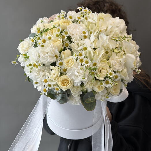 A delicate composition in a snow-white box "Daisies from a loved one"