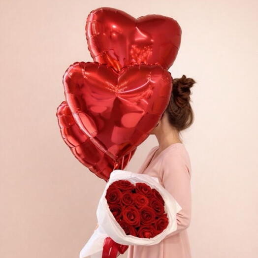 Red rises with heart shaped foil balloons