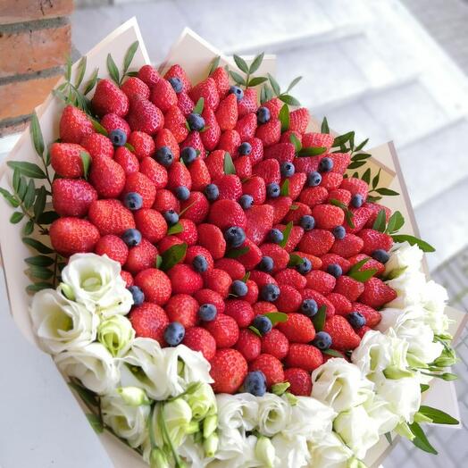Bouquet of strawberries, blueberries and eustoma
