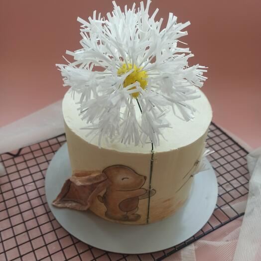 A baby cake with a dandelion and a bunny as a birthday present