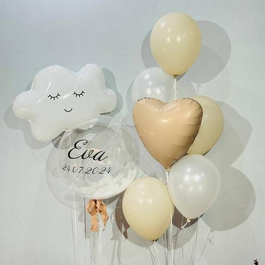 Helium balloons in white and beige with little clouds for a baby's birth celebration.