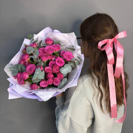 Bouquet of pink bush roses with eucalyptus for a girl