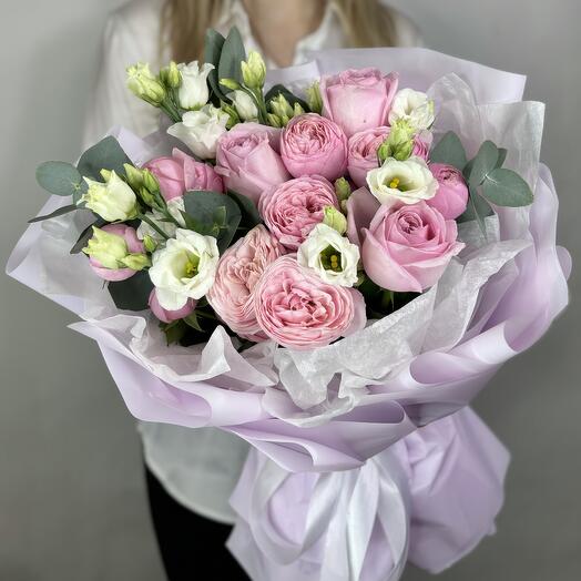 Peony-shaped pink roses and eustoma in a bouquet