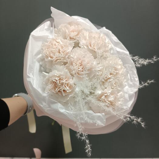 The bouquet with carnations is delicate