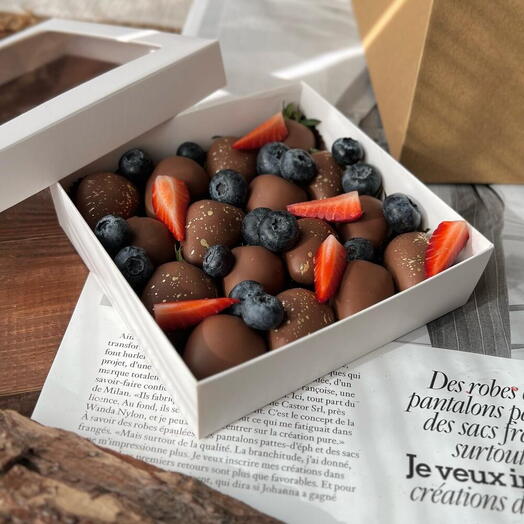 Chocolate covered strawberries with blueberries and strawberry slices