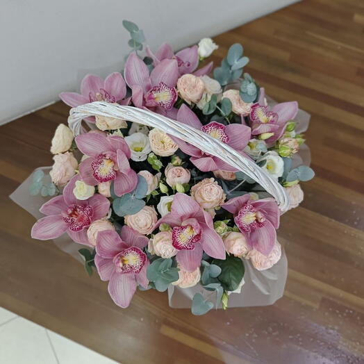 Basket with orchid and eucalyptus