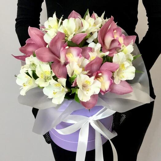 Orchid and alstrameria in a hatbox