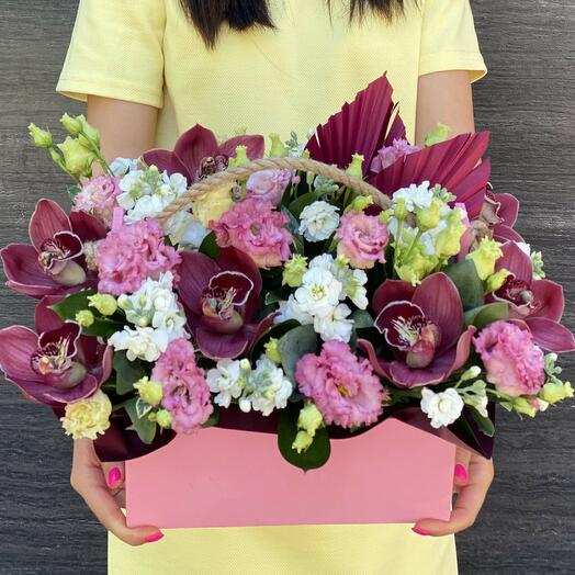 Delicate composition: Orchids in a stylish box - a modern trend