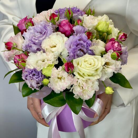A bush rose with an eustoma in a box