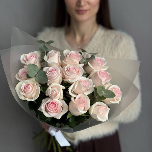 A delicate bouquet of 15 roses and eucalyptus