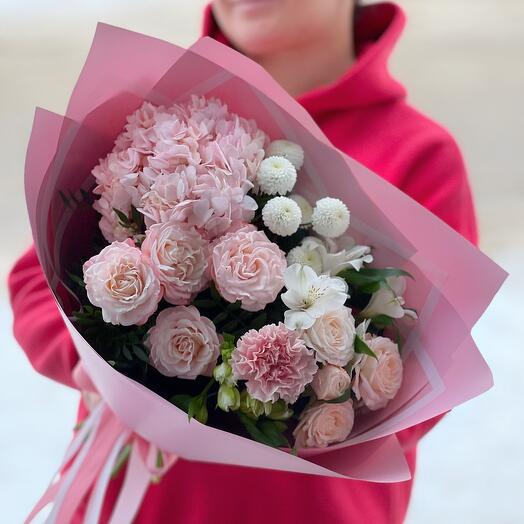 Delicate, cute pink bouquet pink hydrangea, pink peony-shaped roses, bush chrysanthemum, alstroemeria, dianthus