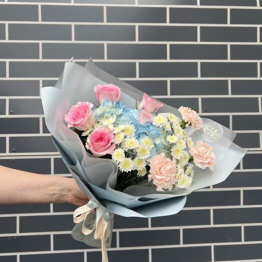 Delicate bouquet of hydrangeas, roses and dianthus
