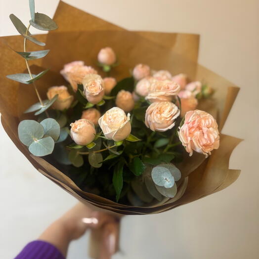 A compliment of bushy peony-shaped roses in craft