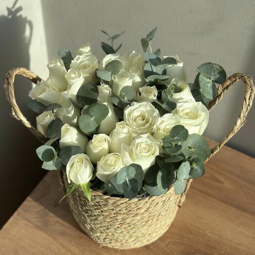white roses in basket