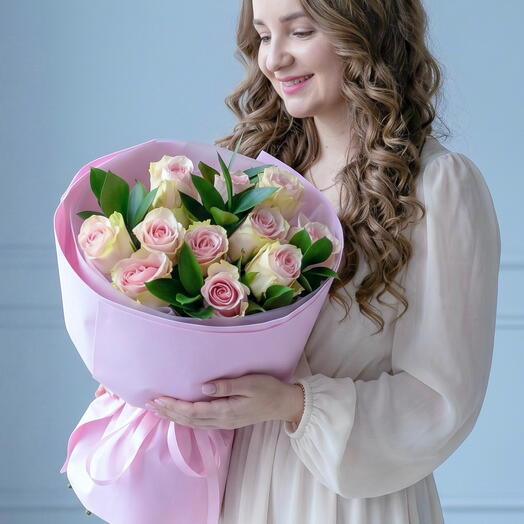 Bouquet of 11 delicate roses and sprigs of juicy premium ruskus in designer packaging