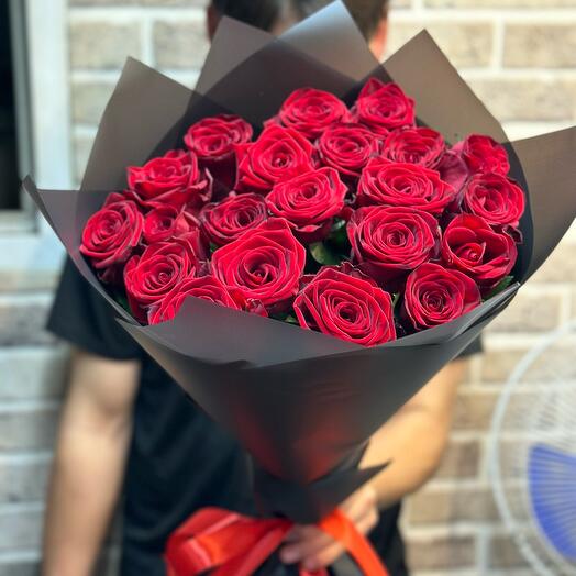 Red roses in a black package