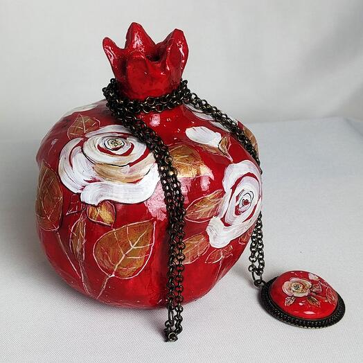 Artistic statuette "Pomegranate" with a medallion