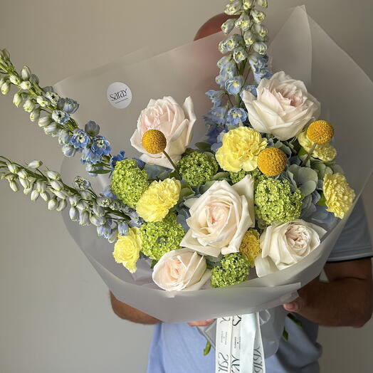 Bouquet with delphinium, roses O hara and viburnum