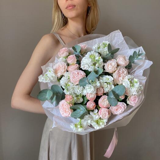 Stylish bouquet of bush roses and mattiola with eucalyptus twigs