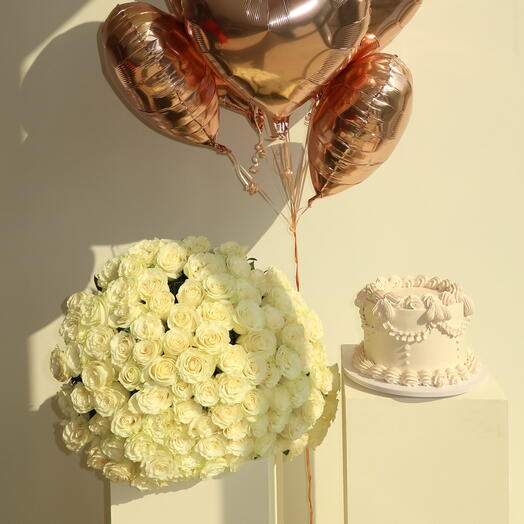 Set of - 100 white premium roses, cake with chocolate crunchy filling and 10 heart shaped balloons