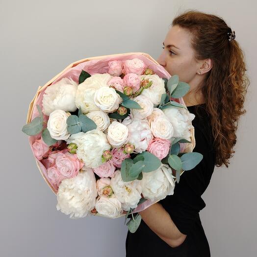 White peonies and peony-shaped roses in a delicate bouquet