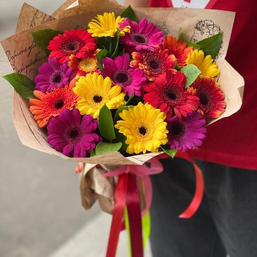 Bouquet of 17 gerberas with greenery in craft with a satin ribbon