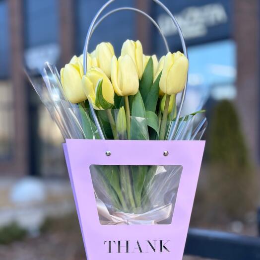 A Bouquet of Yellow Tulips in a Handbag