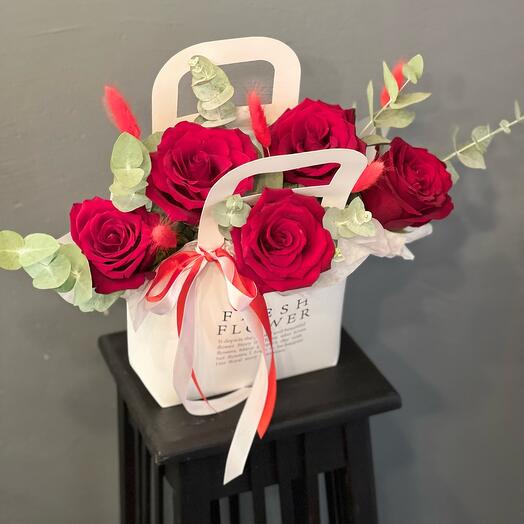 Red roses with eucalyptus in a stylish "Feelings" design