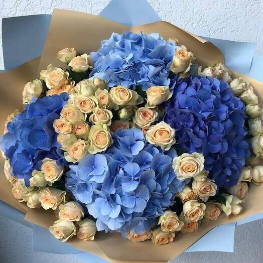 Bouquet of blue, light blue hydrangeas and beige bushy rose