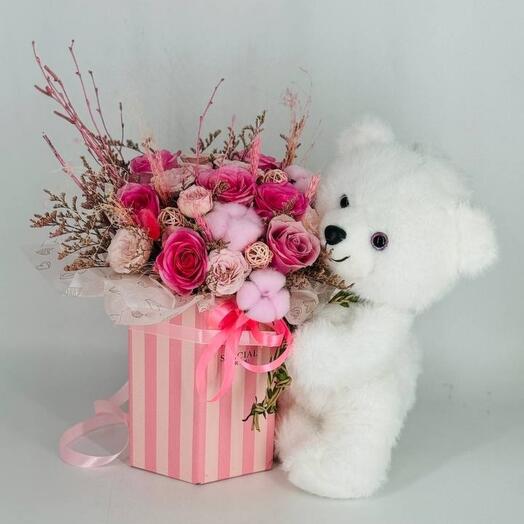 Pink rose flowers with a white soft teddy bear in a gift box children's bouquet