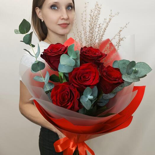 Red roses in stylish packaging